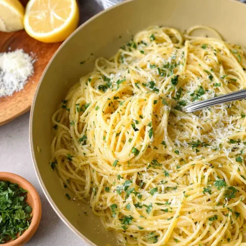 15 Minute Lemon Herb Pasta in a bowl, tossed with parsley, lemon zest, and Parmesan cheese